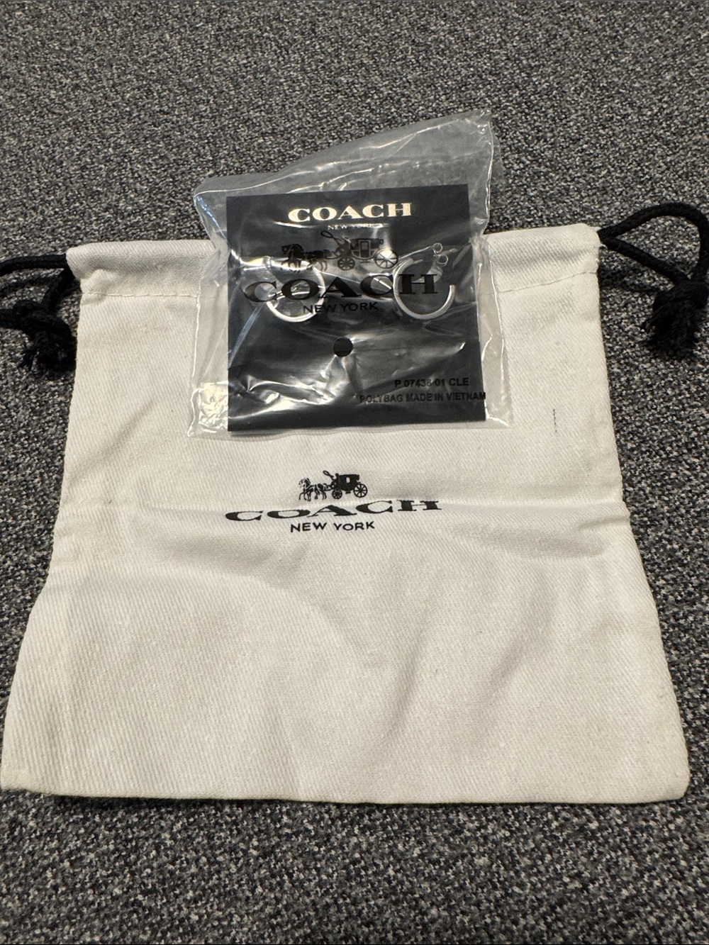 Coach earrings with Branded Pouch